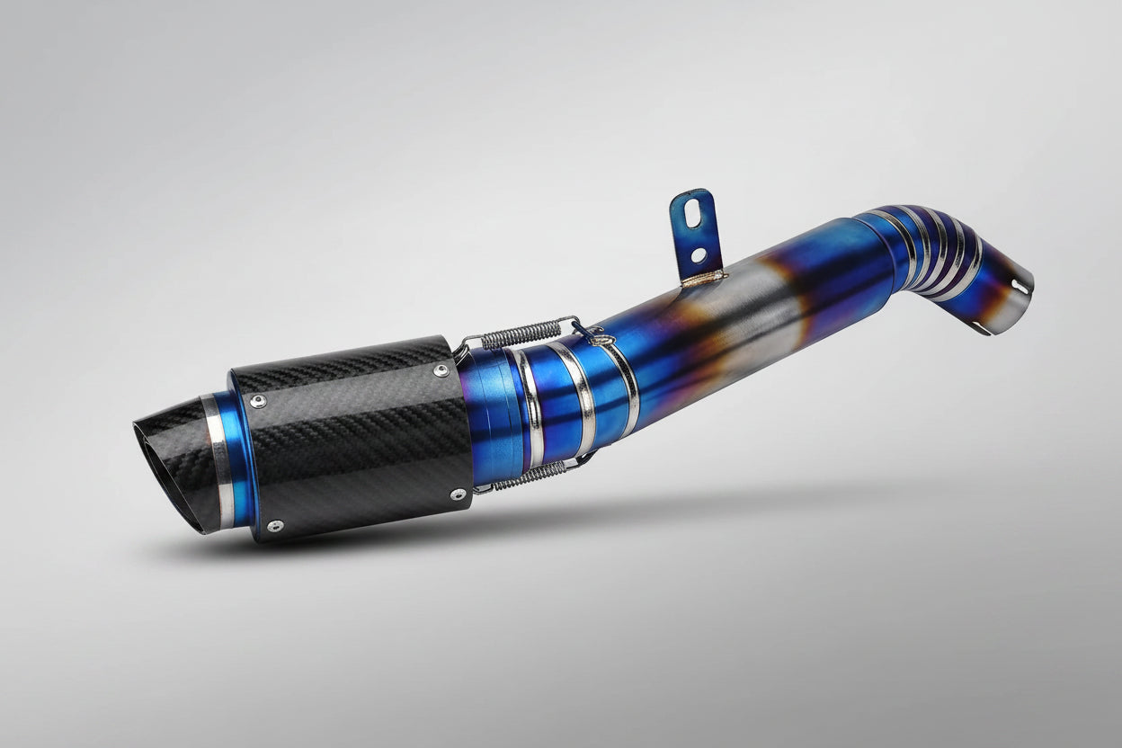 A high-performance motorcycle exhaust tip and muffler from NKLAIM, featuring a metallic blue and orange flame-tinted titanium body with a black carbon-fiber-textured muffler collar.